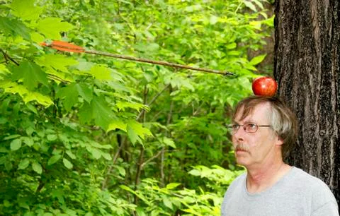 Shooting an apple off of his head Stock Photos
