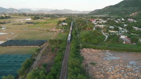 Shooting the approaching train on a flying camera overlooking the mountains Video stock 100188861