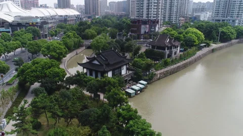 Shooting around half a circle centered around Chinese architecture. Video stock 248406868