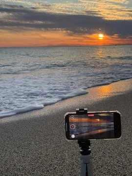 Shooting on the beach at sunset Stock Photos