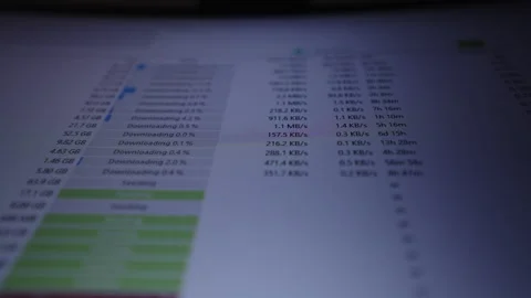 Shooting from below of computer screen showing p2p client interface with close Stock Footage 320674360