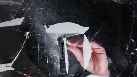 Shooting from below through a transparent table hand holds a credit card Stock Footage 261185205