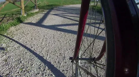 Shooting on board moving bicycle front wheel Stock Footage 48910403