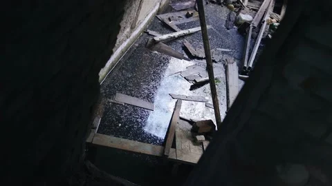 Shooting with a camera from the bottom of the flooded basement of an old house Stock Footage 154660728