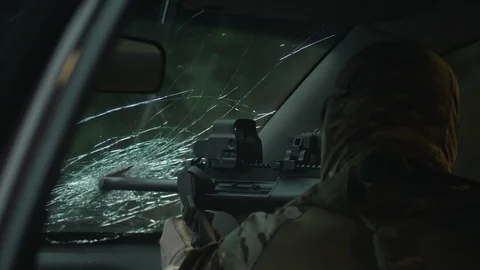 Shooting from a car. Fully equipped sniper. Stock-Footage 107328043