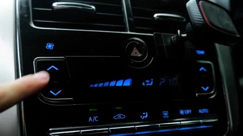 Shooting in the car, increase and decrease the air conditioner, car interior 库存影片 247073731