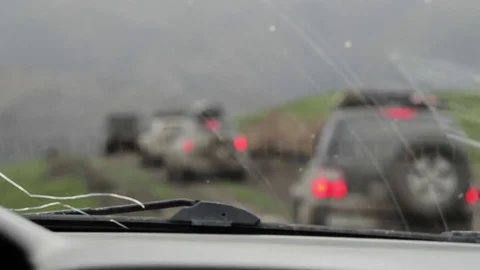 Shooting from car interior as SUV going ahead at cloudy day. Video stock 76049982