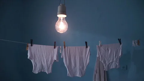 Shooting with Clean Clothes Hanging for Drying on a rope in Bathroom Video stock 129340820
