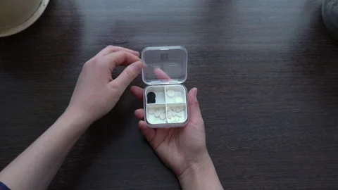 Shooting close-up, hands open a box of pills. Taking your daily pills at home Stock Footage 150035539