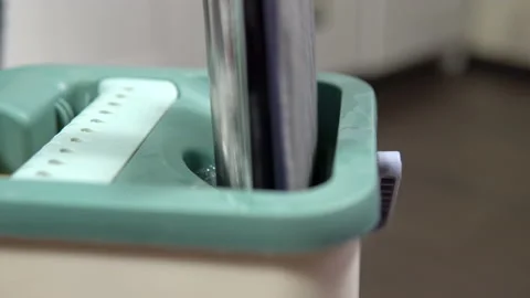 Shooting close-up, the hostess foams a rag in a bucket for cleaning the floors Stock Footage 153904351