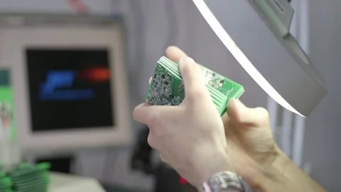 Shooting close-up worker hands checking printed circuit boards 库存影片 79063873