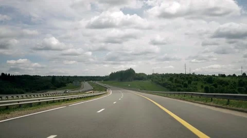 Shooting from the cockpit of a car while driving on a country highway Stock Footage 335817314