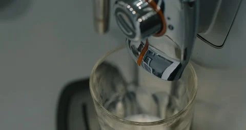 Shooting Of A Coffee Machine Or Coffee Maker From Which The Cooked Hot Coffee Stock Footage 123423011