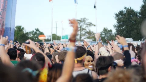 Shooting of the crowd dancing during the fest putting hands up Stock Footage 98223237
