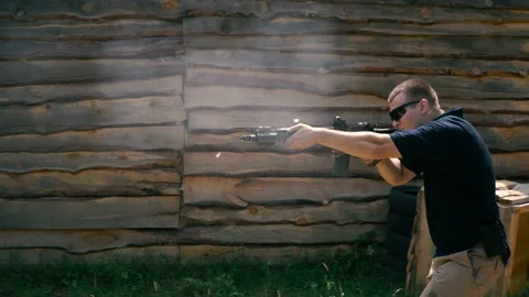 Shooting in a dash. The guy shoots in a dash with a semi-automatic rifle Video stock 100637241