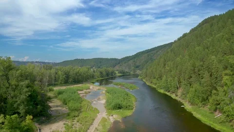 Shooting with the descent of the drone over the river. Stock Footage 114879874