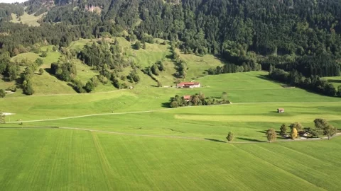 Shooting on a drone in motion an Alpine house with a mountain in the background. Stock Footage 162200345