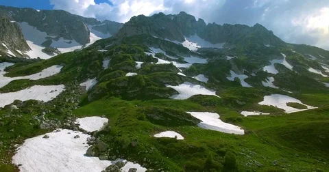 Shooting from the drone of a mountain pass in the Caucasus with green grass and  Stock Footage 83759937