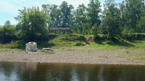 Shooting a drone over a river overlooking the shore. Stock Footage 114727711