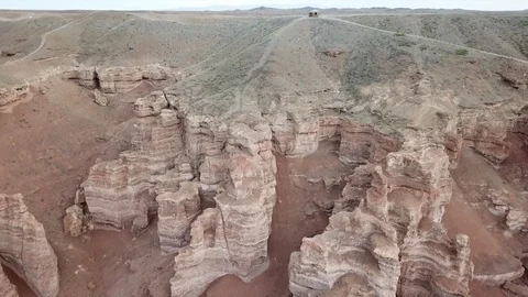 Shooting from a drone, top view of Charyn canyon. Red canyon, Martian view. Video stock 97357475