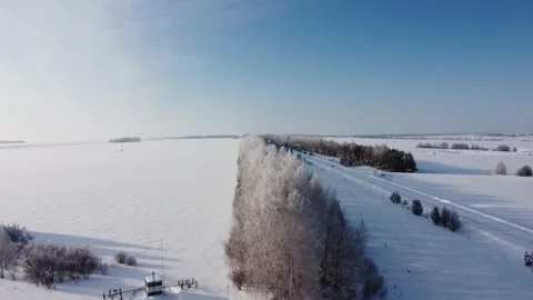 Shooting from a drone in winter forests and fields Stock Footage 170929566