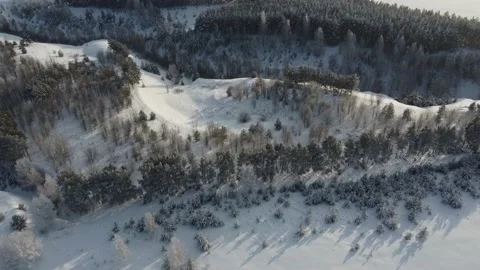 Shooting from a drone in winter forests and fields. Stock Footage 170930104