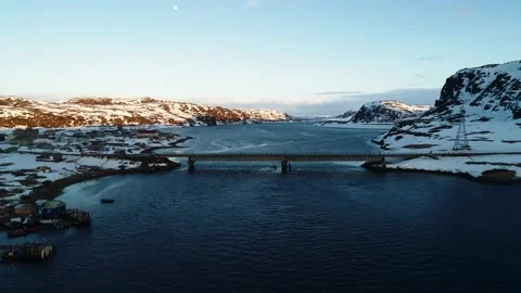 Shooting from a drone in winter over the bridge in the village of Teriberka, the Stock Footage 169464938