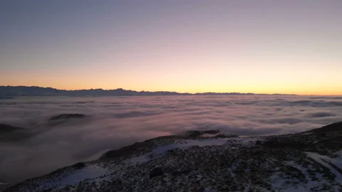 Shooting drone. Winter sunset on top of mountain covered clouds. North Caucasus. Stock Footage 123512132