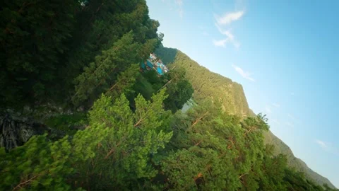 Shooting from a dynamic FPV drone. A flight over a bubbling mountain river with Stock Footage 278366289