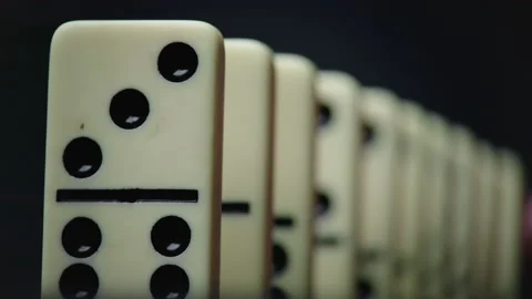 Shooting of falling domino elements - domino effect Video stock 153476465