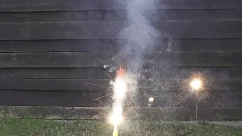 Shooting Off Fireworks on backyard Stock Footage 70424835
