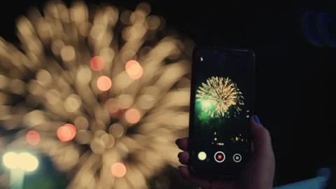 Shooting fireworks on a smartphone Stock Footage 139533600
