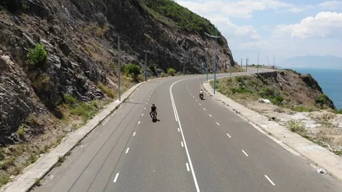 Shooting from a flying camera beautiful road along the sea in Vietnam Stock Footage 100187707