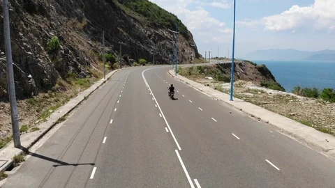 Shooting from a flying camera beautiful road along the sea in Vietnam Video stock 100187740