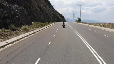 Shooting from a flying camera beautiful road along the sea in Vietnam Stock Footage 100187771