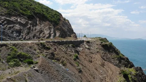 Shooting from a flying camera beautiful road along the sea in Vietnam Stock Footage 100187785