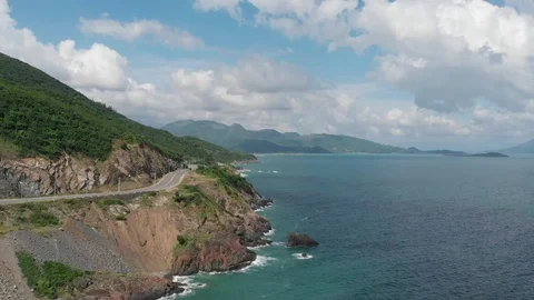 Shooting from a flying camera beautiful road along the sea in Vietnam Stock Footage 100188946