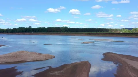 Shooting - flying over a shallow part of the river and over sandy islands. Stock Footage 119073141