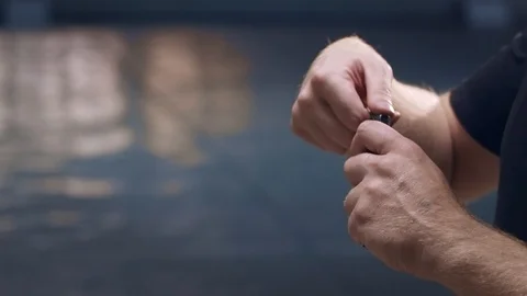 Shooting gallery. A young man preparing the gun and shooting with a firearms. Stock-Footage 117240692