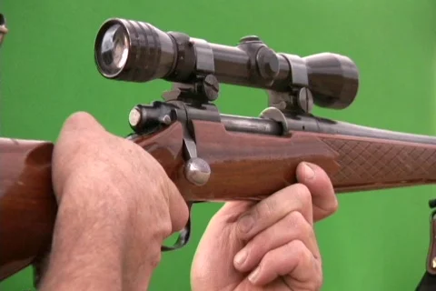 Shooting A Gun / Rifle on a Green Screen Stock Footage
