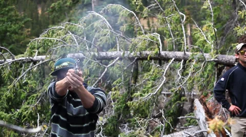 Shooting Handgun in Forest Stock Footage 34517919