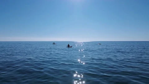 Shooting from a height with drone flying quickly over blue water surface and Stock Footage 145010493