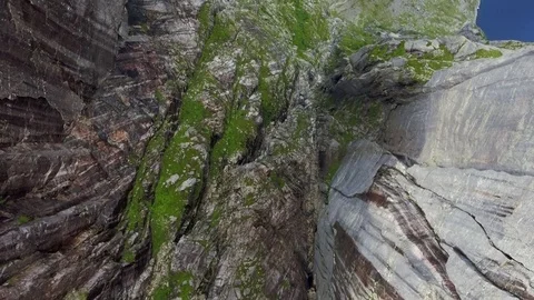 Shooting from the helicopter flying over the gorge between the huge rocks near Stock Footage 80250714
