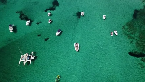 Shooting at high altitude with the drone as it rises above the boats Stock Footage 99037014