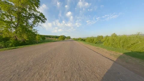 Shooting at high speed. A small paved track in the countryside. Travelling for Stock Footage 154527254