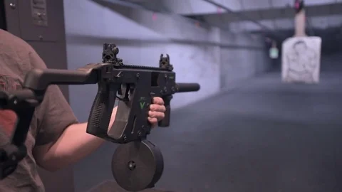 Shooting indoor Kriss Vector handoff Stock Footage 85128948
