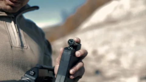 Shooting instructor loading ammo into magazine Stock Footage 102661638
