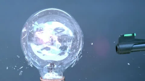 Shooting light bulb with BB gun up close Stock Footage 12624991