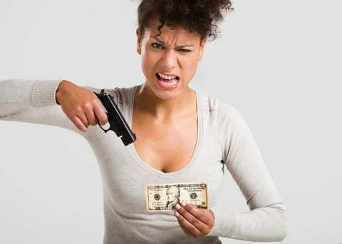 Shooting money Stock Photos