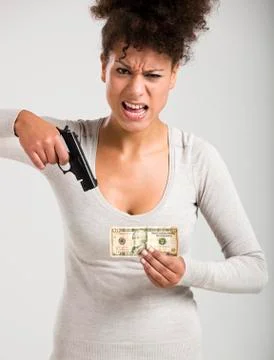 Shooting money Stock Photos
